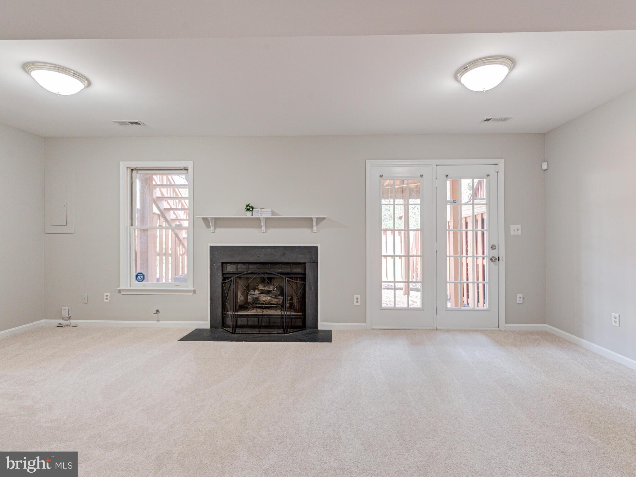 21140 Dray Terrace Ashburn, VA 20147 - Photo 41 of 59 Rec Room walks out to Fenced Back Yard & Patio