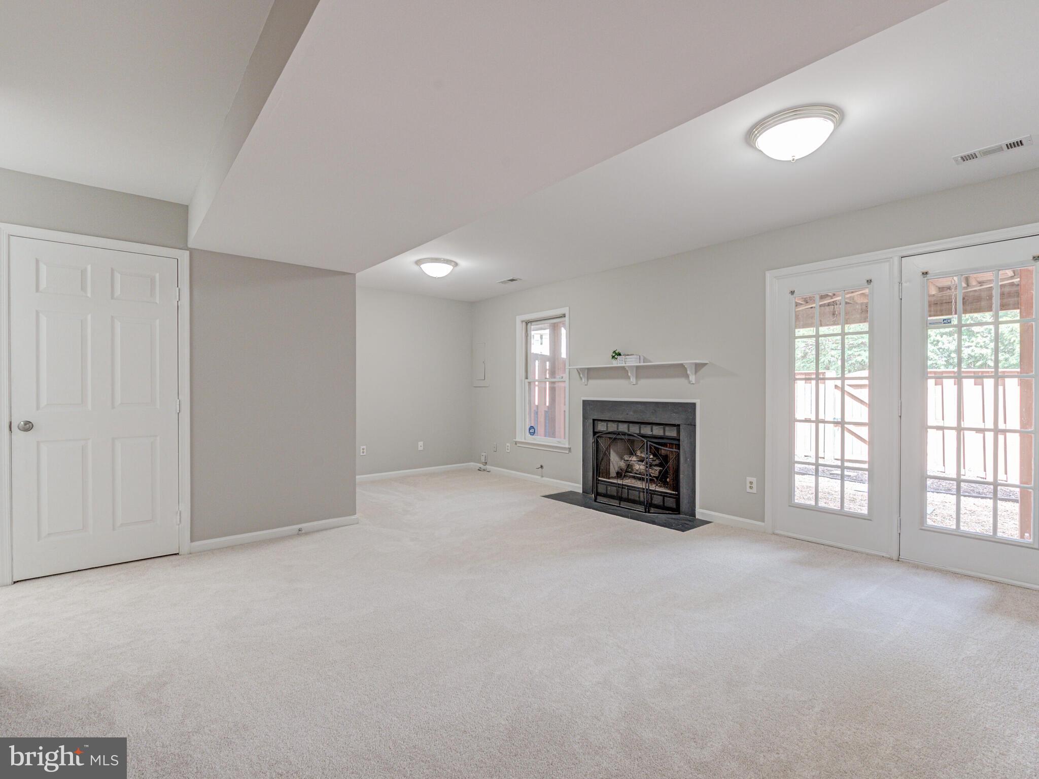 21140 Dray Terrace Ashburn, VA 20147 - Photo 42 of 59 Rec Room walks out to Fenced Back Yard & Patio