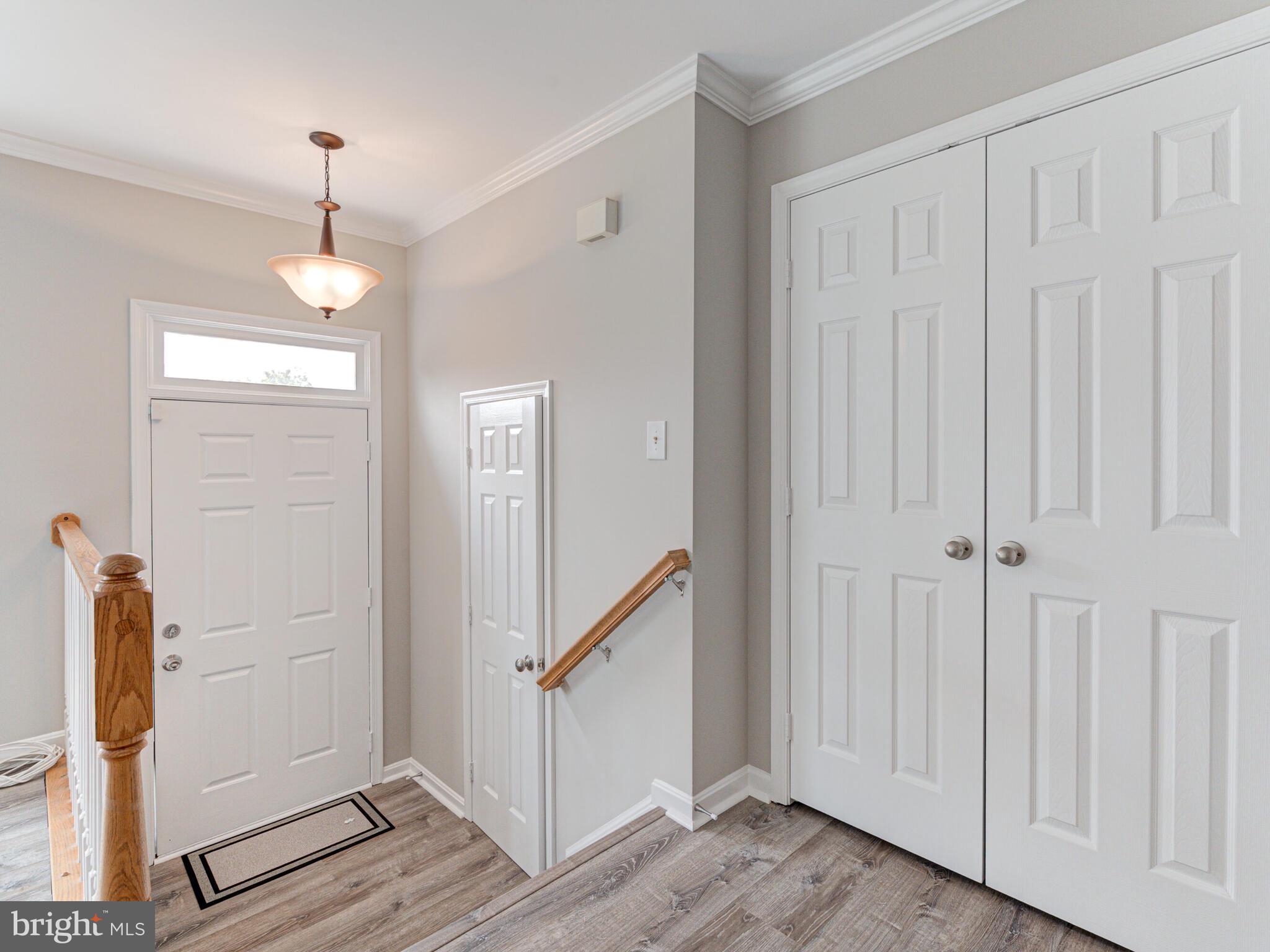 21140 Dray Terrace Ashburn, VA 20147 - Photo 5 of 59 Foyer with Half Bath & Large Coat Closet