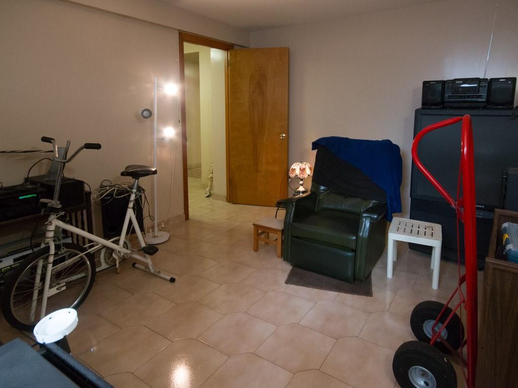 426 Ave Y Brooklyn, NY 11223 - Photo 11 of 25 a living room with furniture and a air conditioner vent