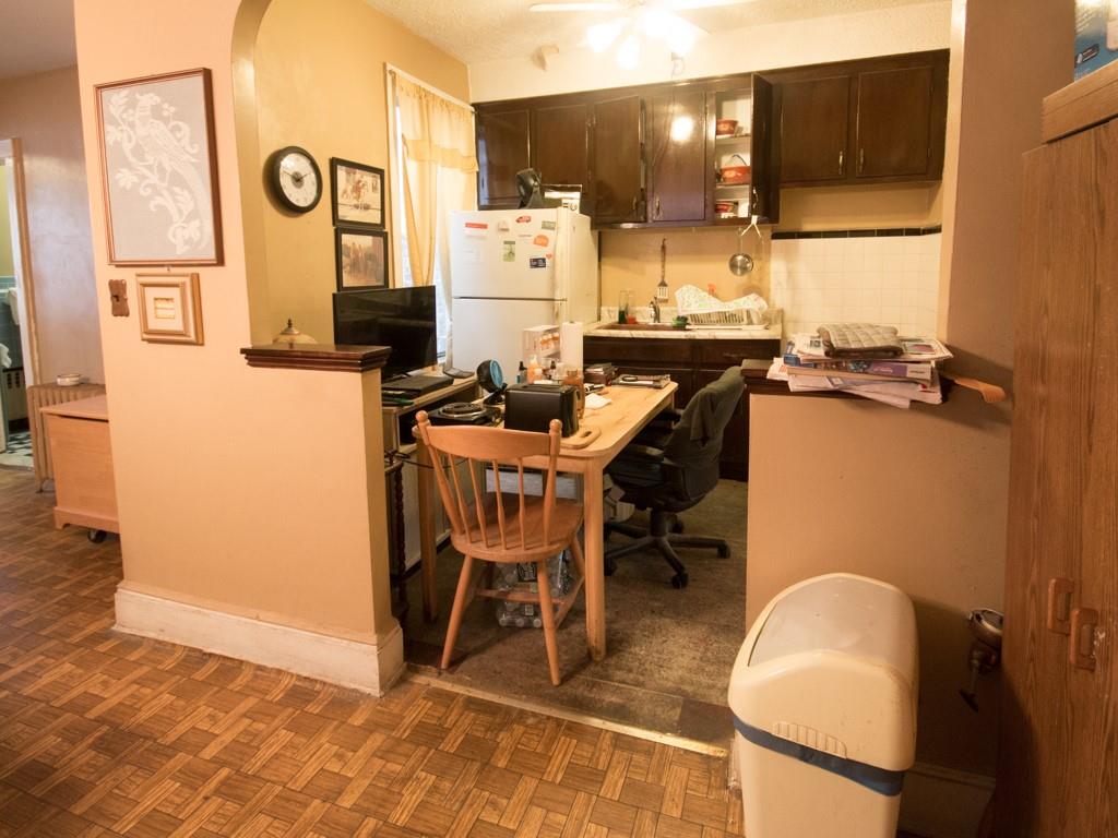 426 Ave Y Brooklyn, NY 11223 - Photo 17 of 25 a room with stainless steel appliances kitchen island granite countertop furniture a refrigerator and a sink
