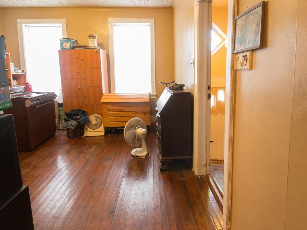426 Ave Y Brooklyn, NY 11223 - Photo 20 of 25 a view of a living room with furniture and wooden floor