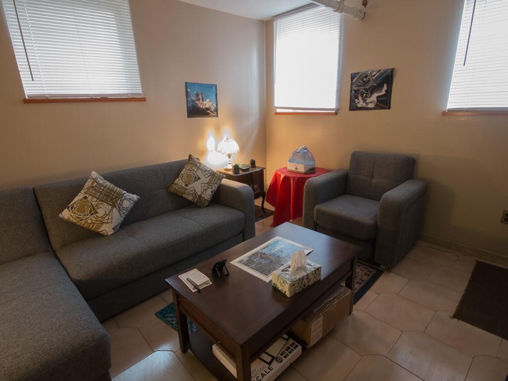 426 Ave Y Brooklyn, NY 11223 - Photo 3 of 25 a living room with furniture and a couch