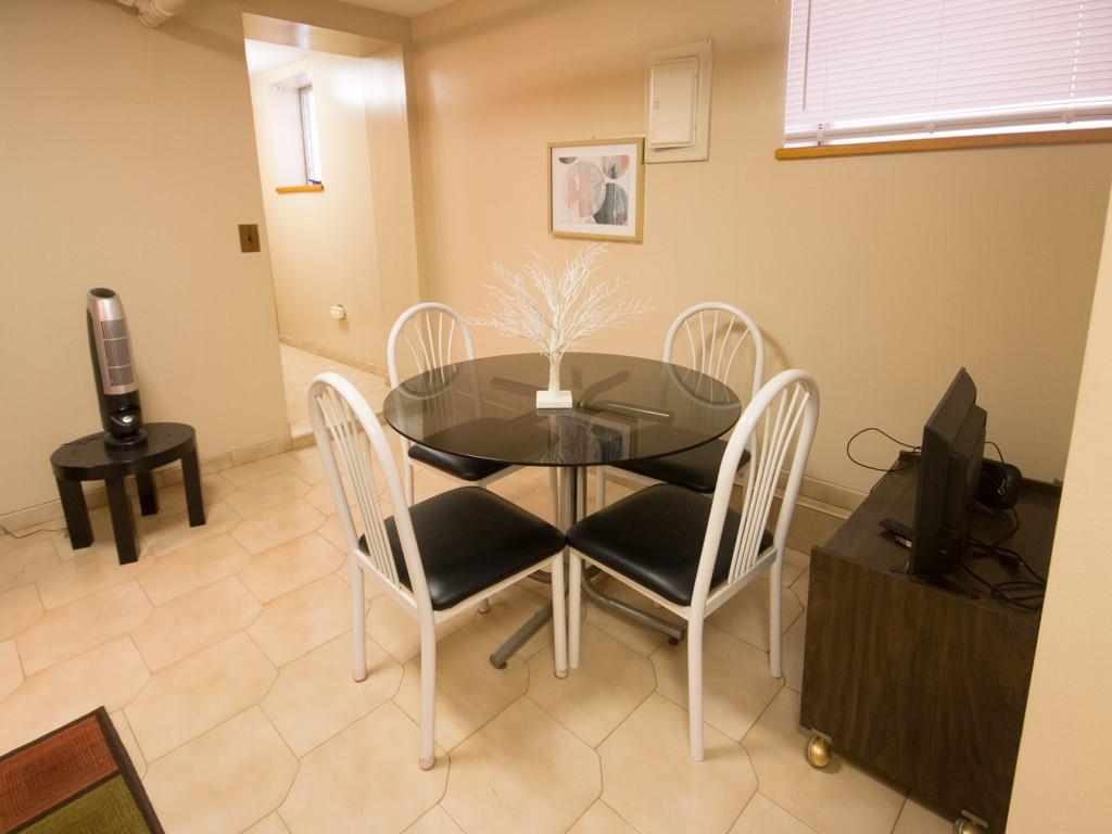 426 Ave Y Brooklyn, NY 11223 - Photo 8 of 25 a dining room with furniture and a window