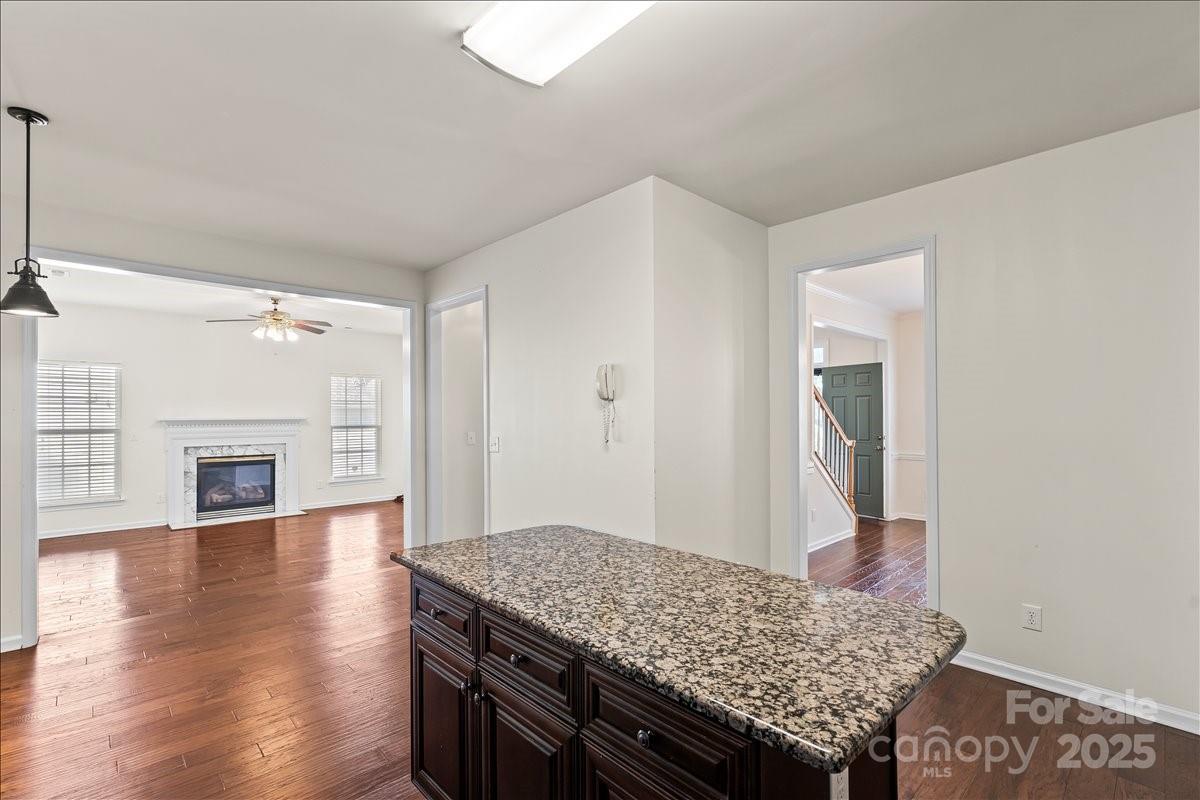 11938 Harmon Lane Pineville, NC 28134 - Photo 13 of 36 a living room with granite countertop furniture and a fireplace