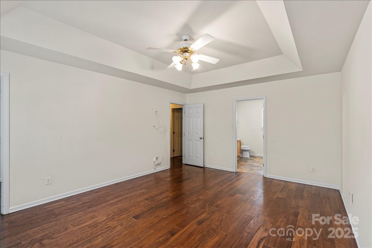 11938 Harmon Lane Pineville, NC 28134 - Photo 20 of 36 wooden floor in an empty room with a window