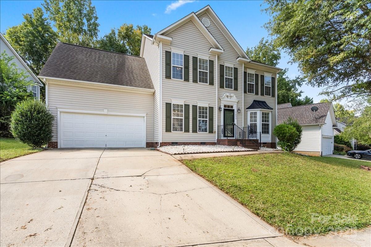 11938 Harmon Lane Pineville, NC 28134 - Photo 2 of 36 a front view of a house with a yard