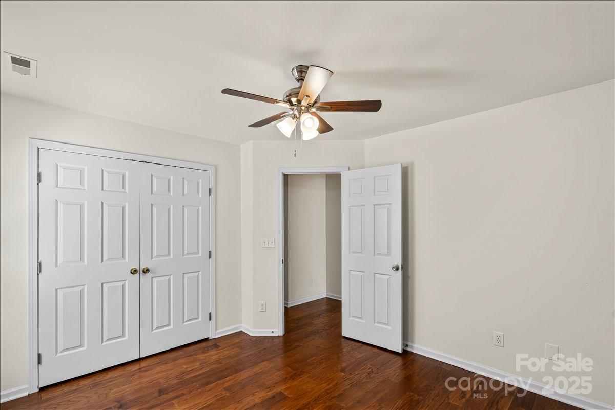 11938 Harmon Lane Pineville, NC 28134 - Photo 24 of 36 wooden floor in an empty room with a window