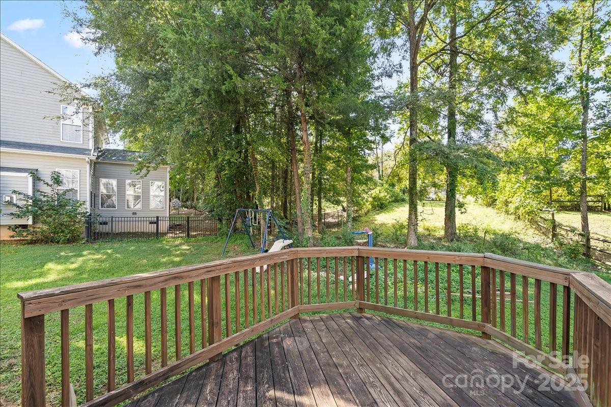 11938 Harmon Lane Pineville, NC 28134 - Photo 34 of 36 a view of a wooden roof deck