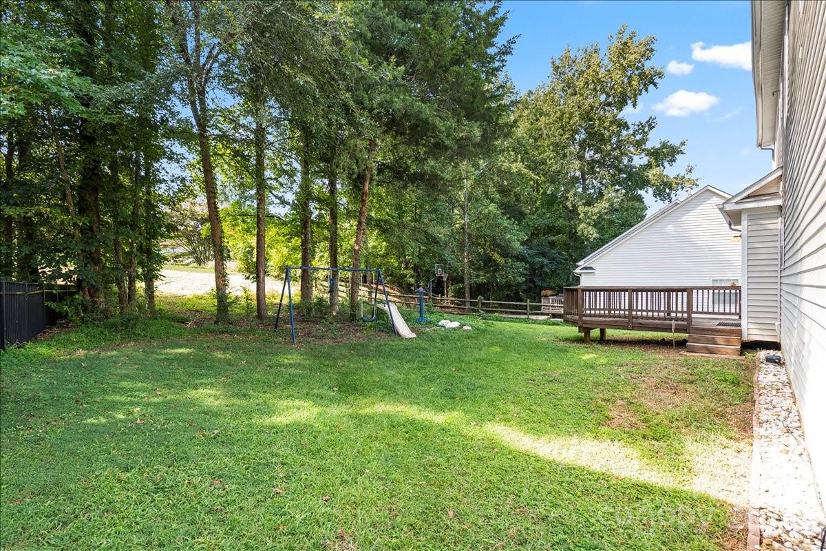 11938 Harmon Lane Pineville, NC 28134 - Photo 36 of 36 a view of backyard of house with green space