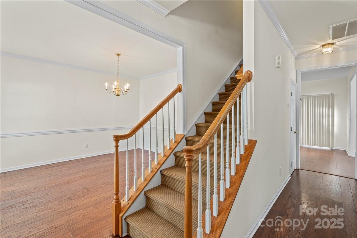 11938 Harmon Lane Pineville, NC 28134 - Photo 4 of 36 a view of entryway and hall with wooden floor