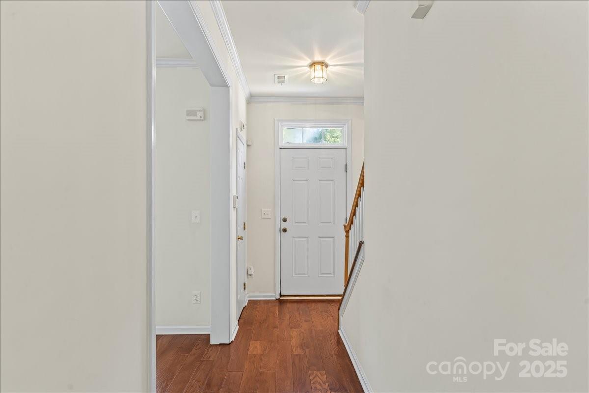 11938 Harmon Lane Pineville, NC 28134 - Photo 5 of 36 a view of a hallway with wooden floor and closet