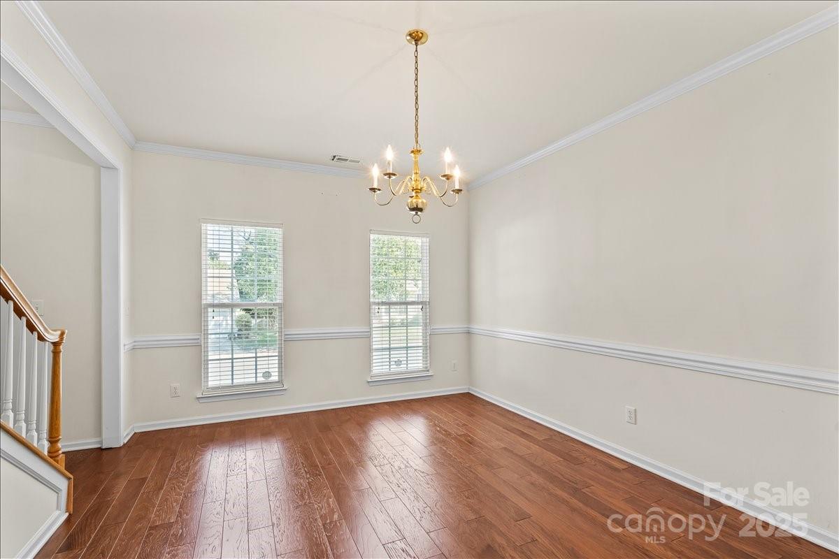 11938 Harmon Lane Pineville, NC 28134 - Photo 6 of 36 wooden floor in an empty room with a window