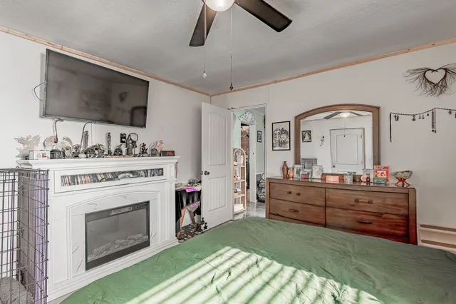 a bed room with a bed and a television