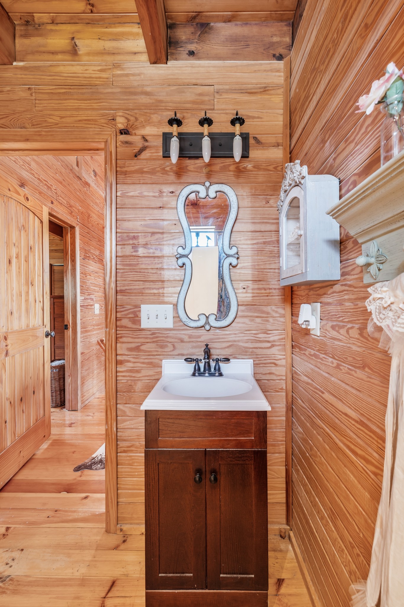 7997 Shoals Branch Road Primm Springs, TN 38476 - Photo 31 of 50 a bathroom with a sink and a mirror