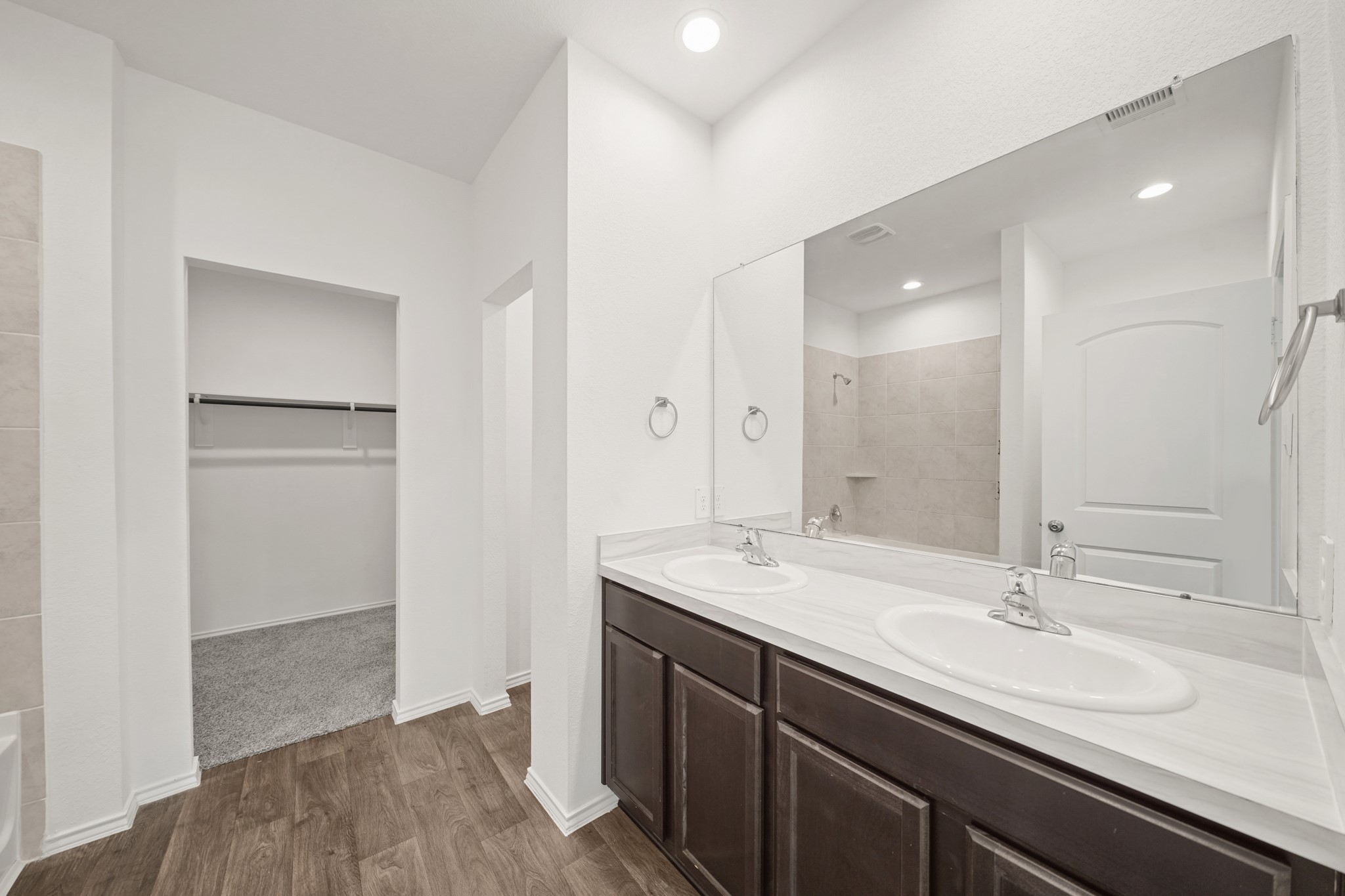 2406 Silver Prairie Ln Spring Spring, TX 77373 - Photo 15 of 30 a bathroom with a sink and a mirror