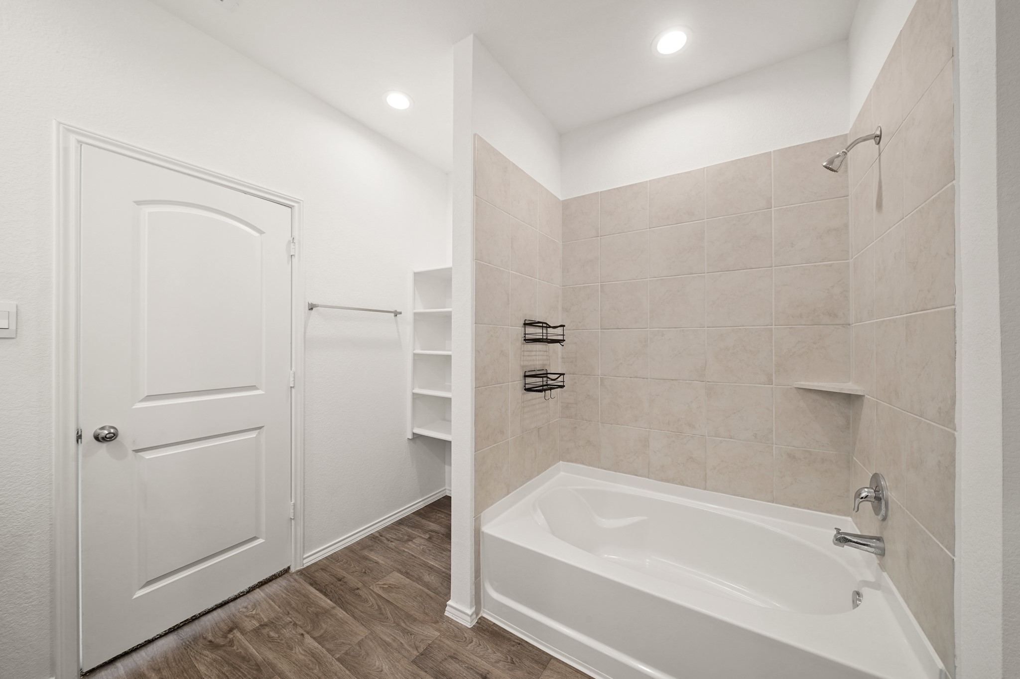 2406 Silver Prairie Ln Spring Spring, TX 77373 - Photo 17 of 30 a bathroom with a bathtub and a shower