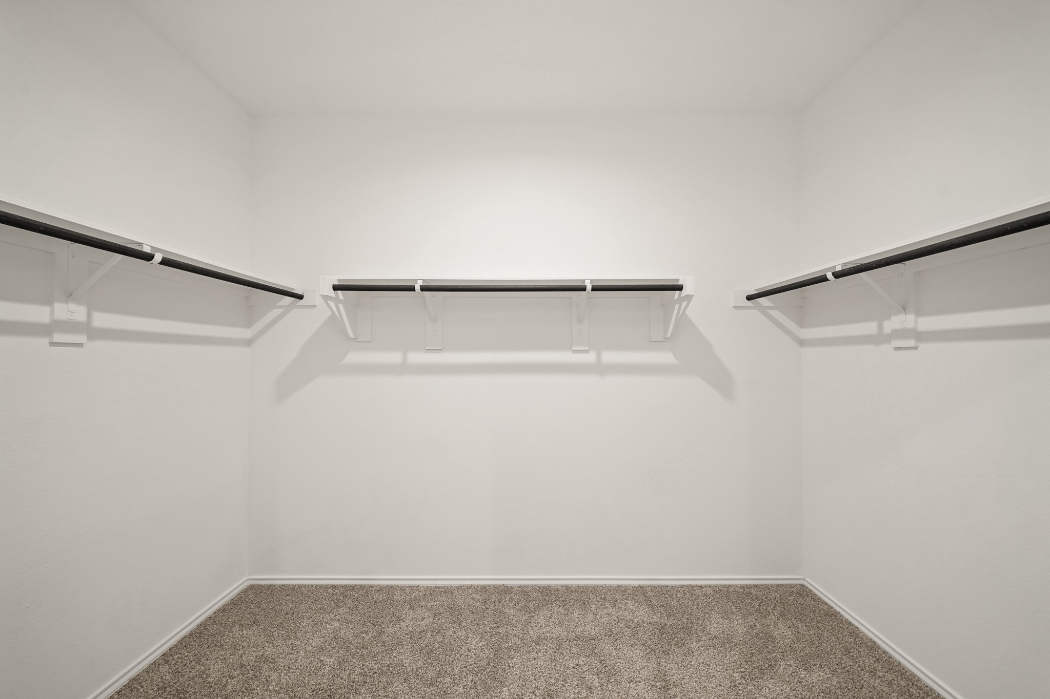 2406 Silver Prairie Ln Spring Spring, TX 77373 - Photo 18 of 30 a view of a room with racks on the wall