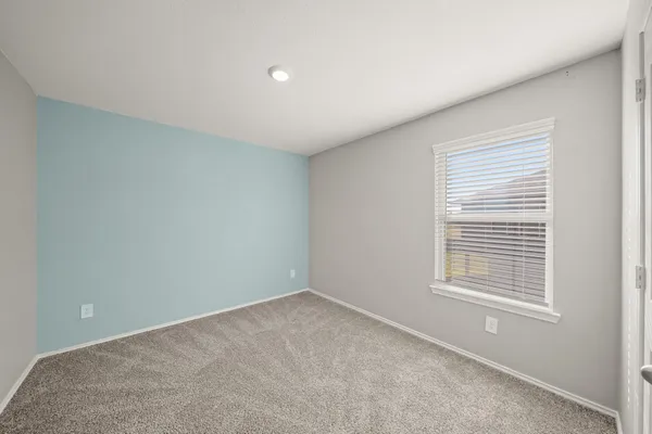 a view of a room that has a window in it