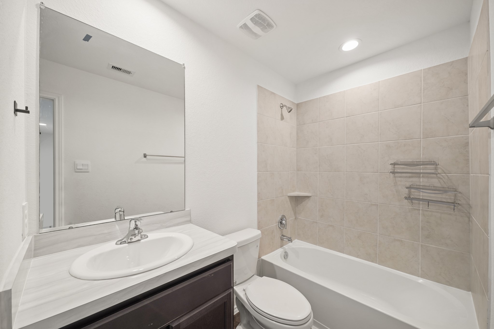 2406 Silver Prairie Ln Spring Spring, TX 77373 - Photo 23 of 30 a bathroom with a granite countertop sink toilet and shower