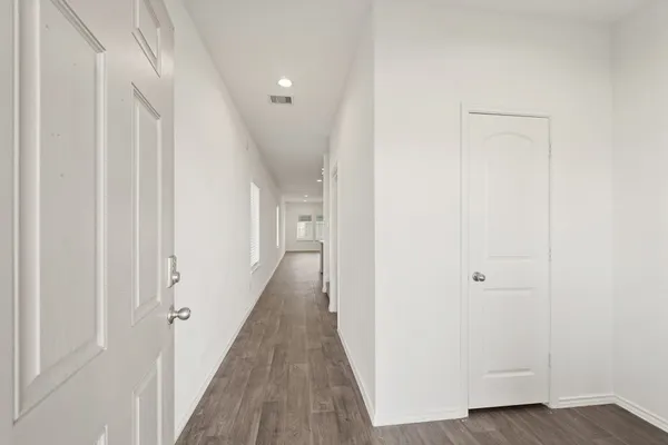 a view of a hallway with the wooden floor