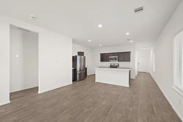 a view of kitchen with refrigerator sink microwave and stove