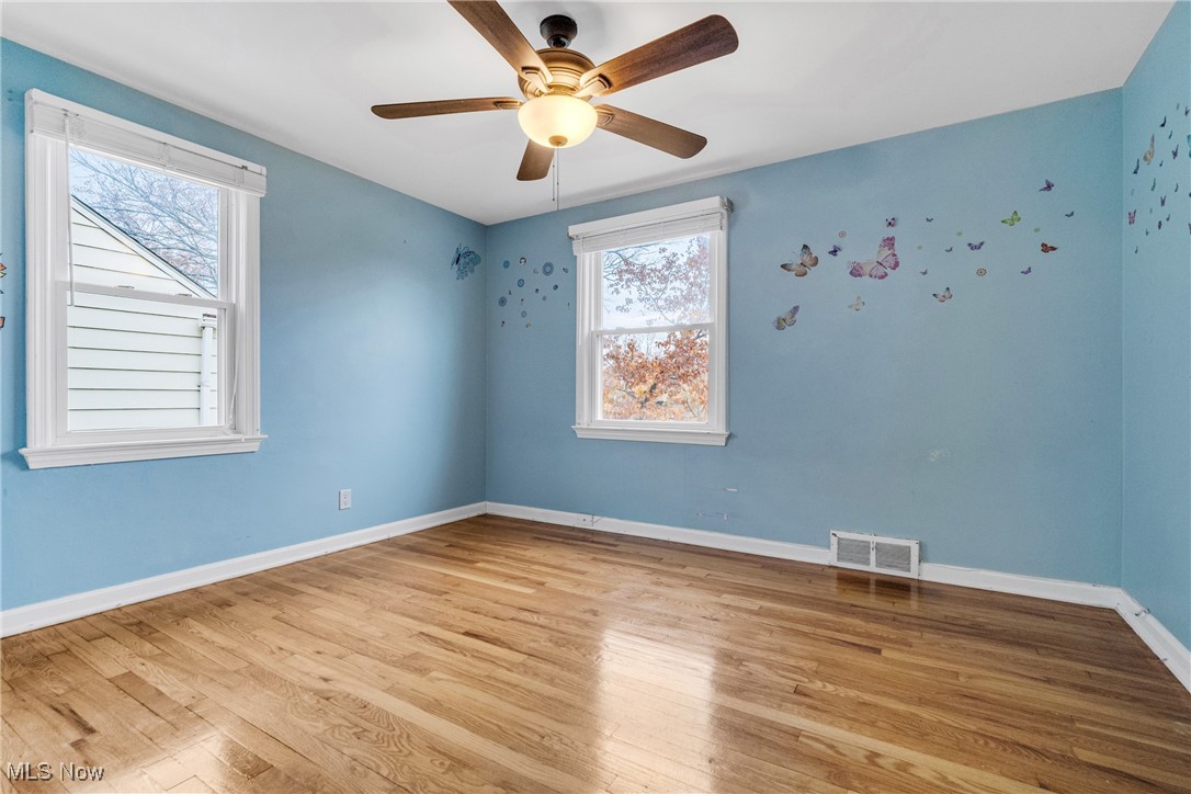 4430 Silsby Road Cleveland, OH 44118 - Photo 29 of 43 Unfurnished room with ceiling fan, plenty of natural light, and light wood-type flooring
