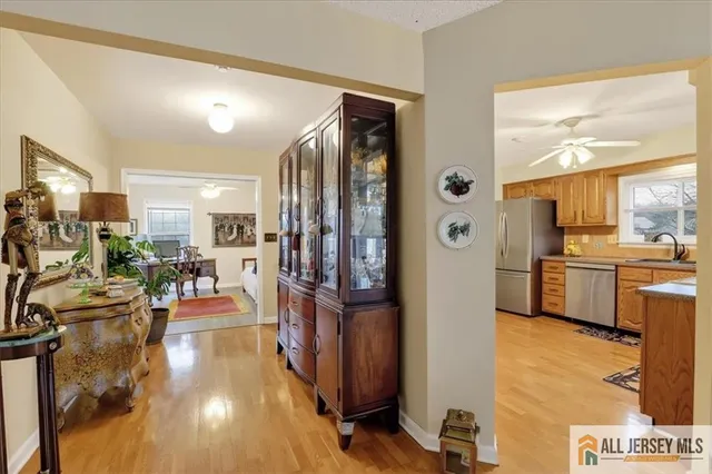 a view of a living room and kitchen