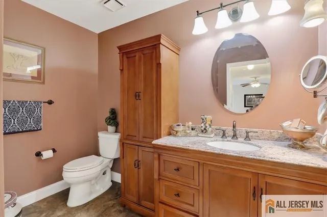 a white toilet sitting next to a shower curtain