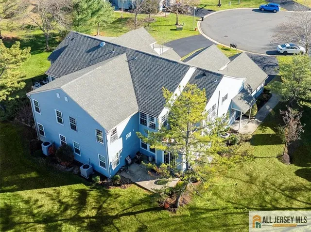 an aerial view of residential house with outdoor space and parking