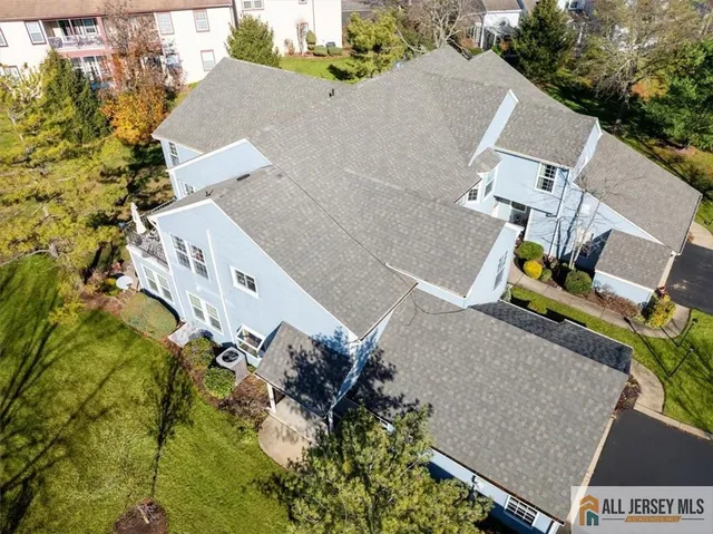 an aerial view of residential houses with outdoor space
