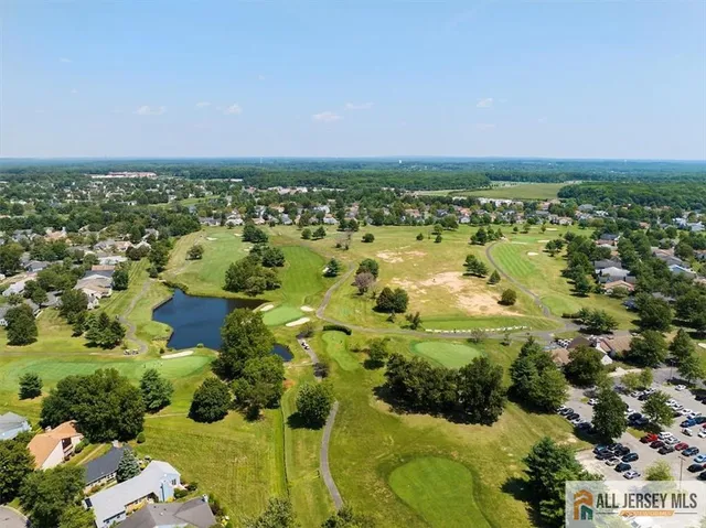 an aerial view of a house with a garden and plants