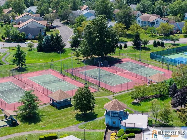 an aerial view of a residential houses with outdoor space
