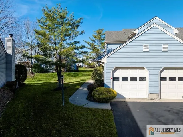 a view of a house with a backyard