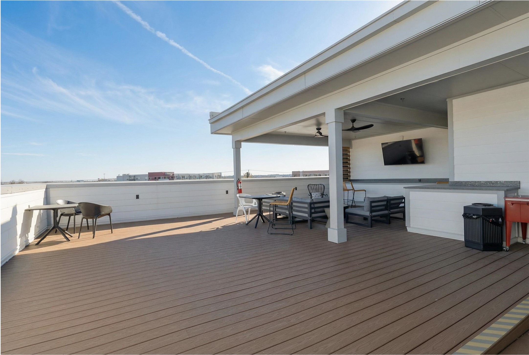 2220 Webberville Road, Unit 303 Austin, TX 78702 - Photo 13 of 14 Wooden deck with a ceiling fan and an outdoor hangout area