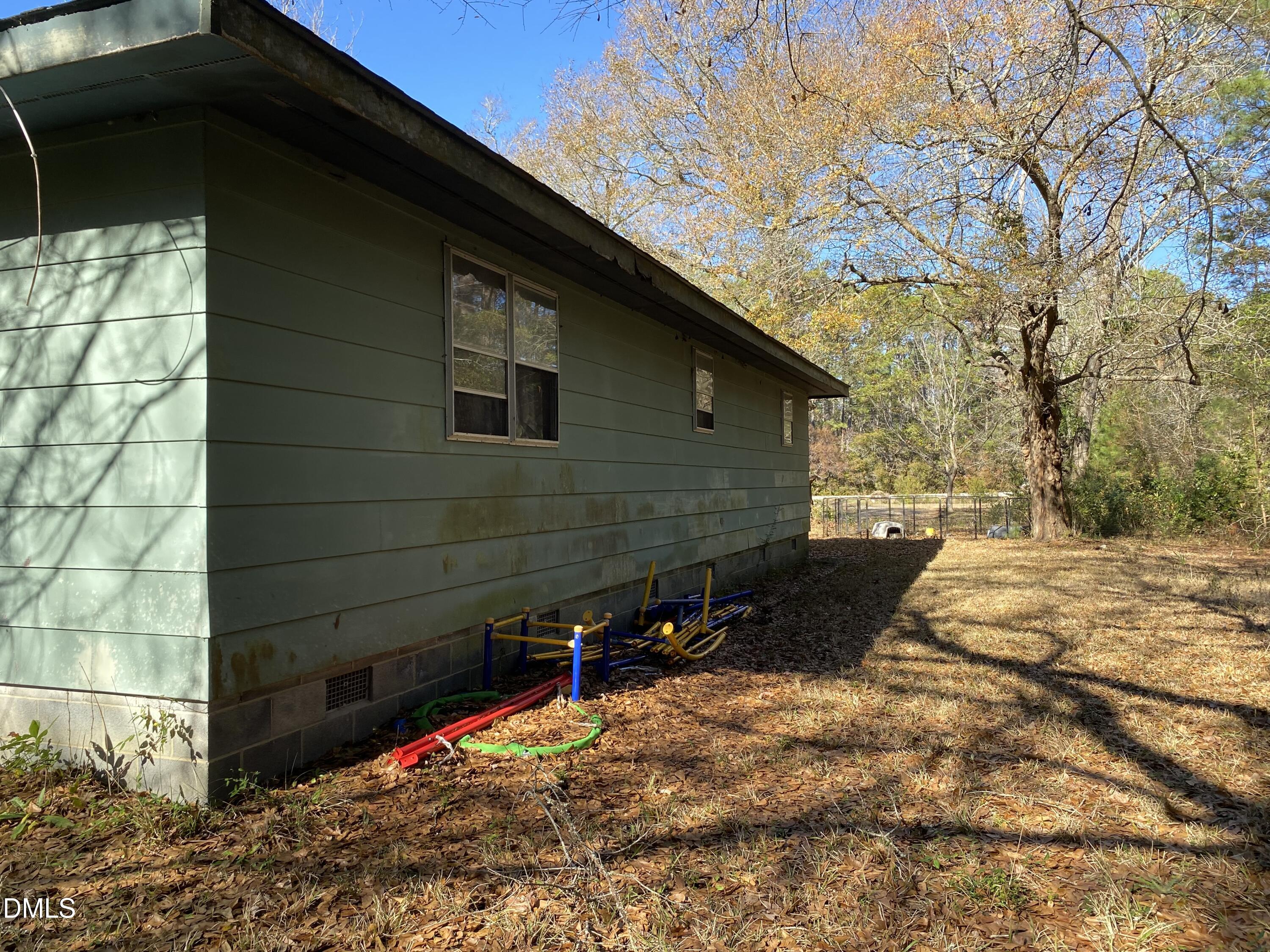 390 Old Winberry Road Newport, NC 28570 - Photo 4 of 9 a backyard of a house with large trees