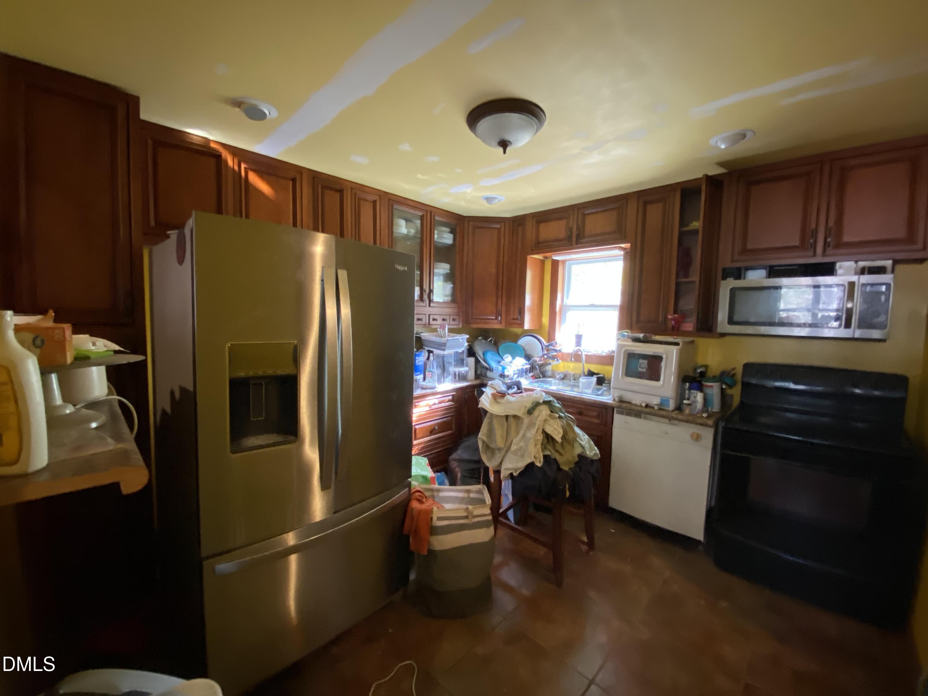 390 Old Winberry Road Newport, NC 28570 - Photo 6 of 9 a kitchen with stainless steel appliances granite countertop a refrigerator stove and microwave