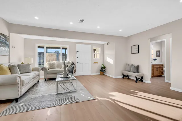 a living room with furniture and a table
