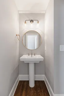 a bathroom with a sink and mirror