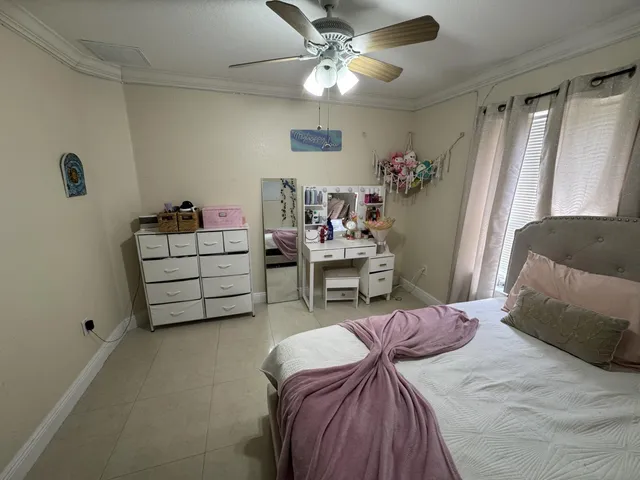 a bedroom with furniture and a window