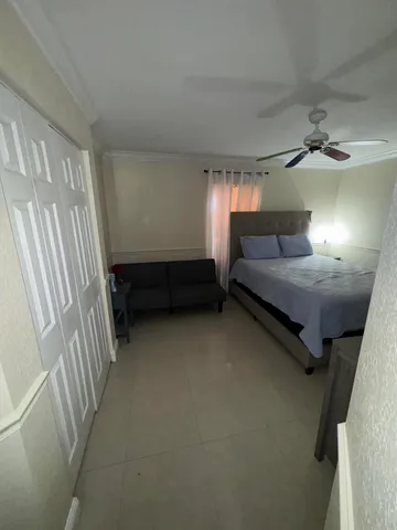 a room with bed and window