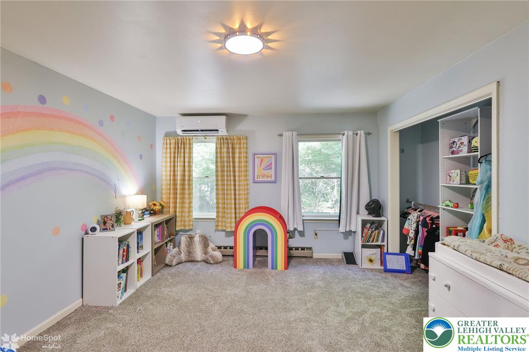 60 Sassafras Road Lehighton, PA 18235 - Photo 25 of 36 A vibrant and inviting bedroom with carpeted floors, bathed in natural light, ready for youthful dreams.