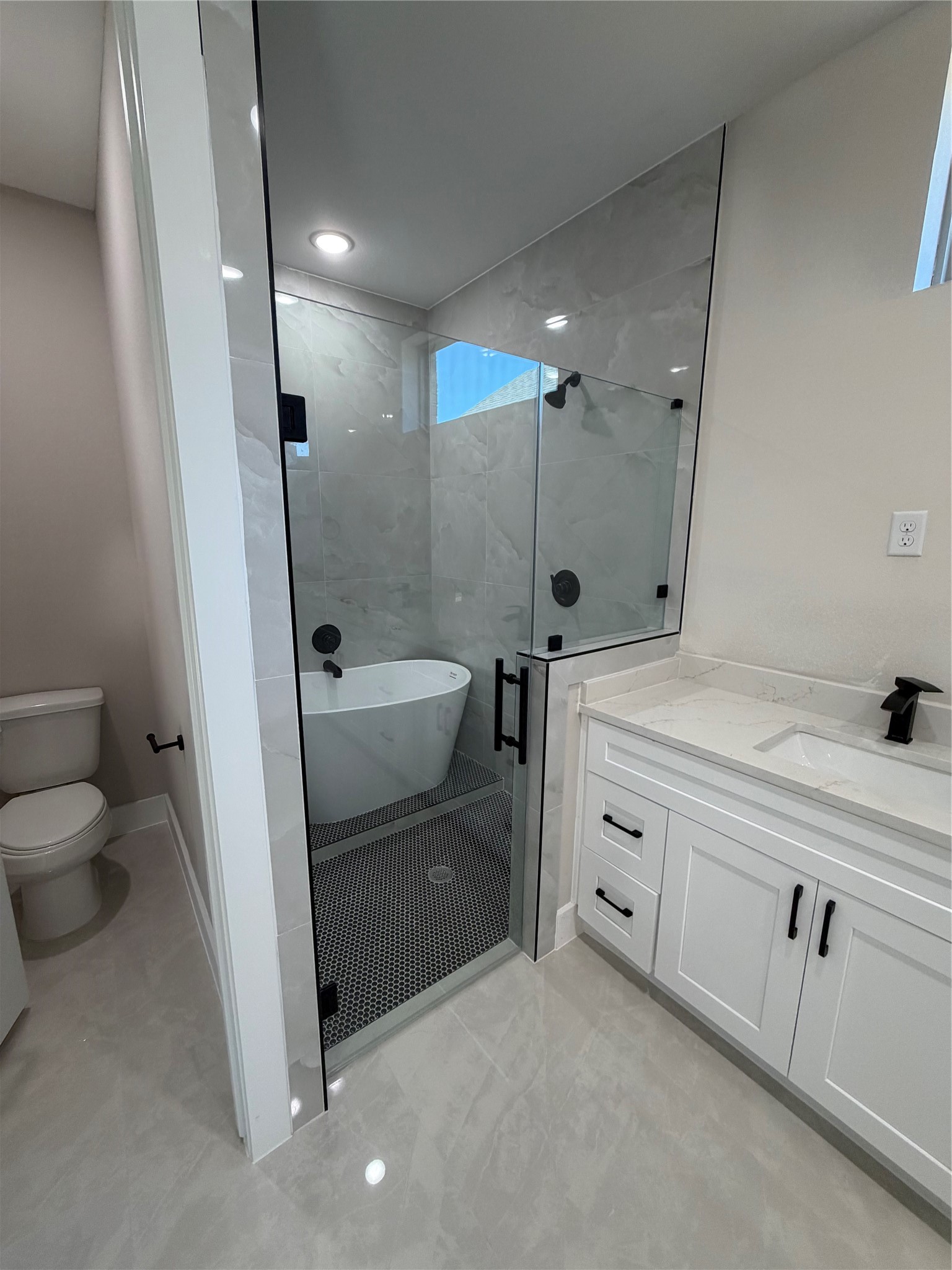 2523 Liguria Lane Spring, TX 77388 - Photo 11 of 30 a bathroom with a sink a toilet and shower