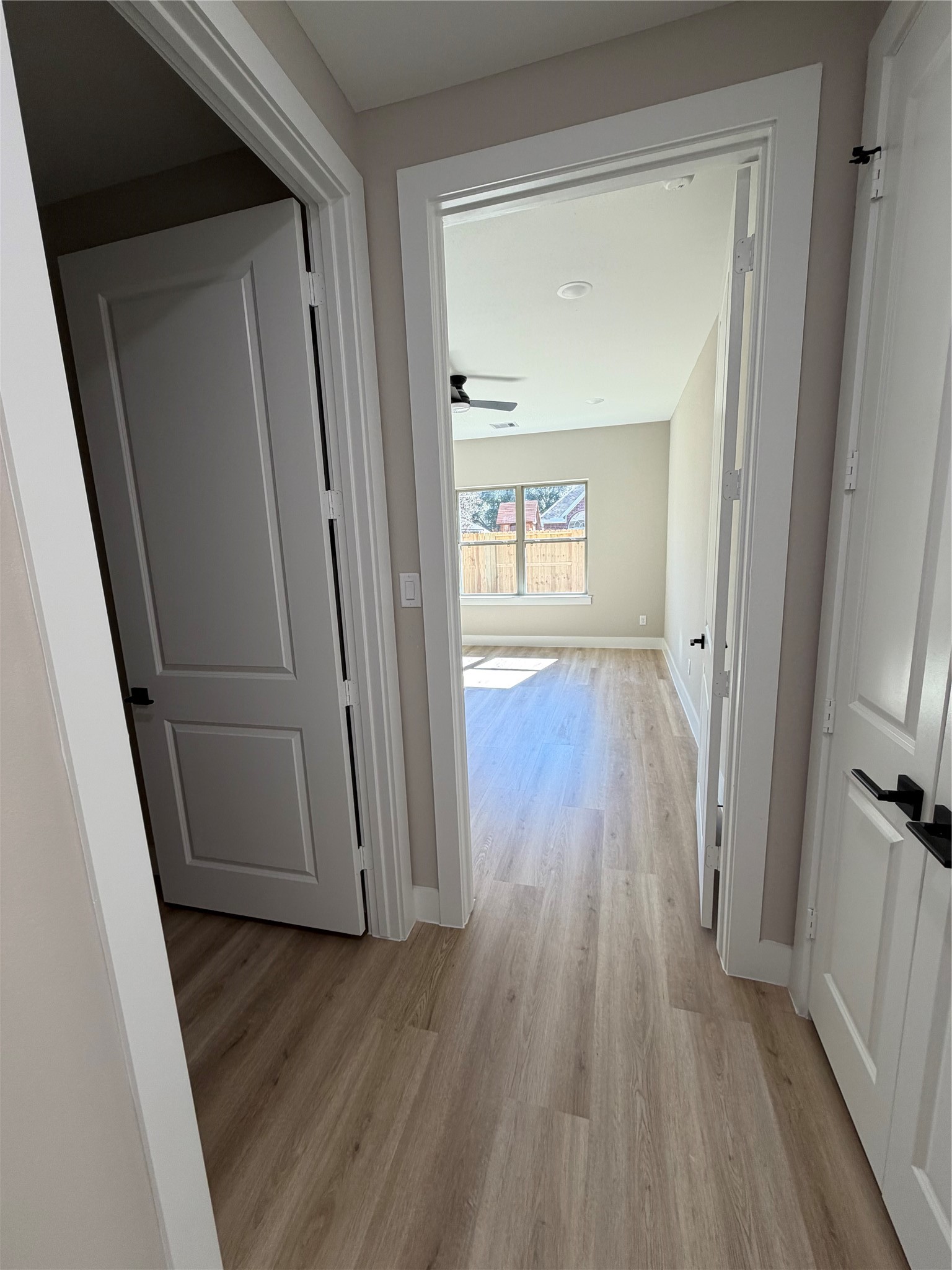 2523 Liguria Lane Spring, TX 77388 - Photo 9 of 30 a view of a hallway with wooden floor and staircase