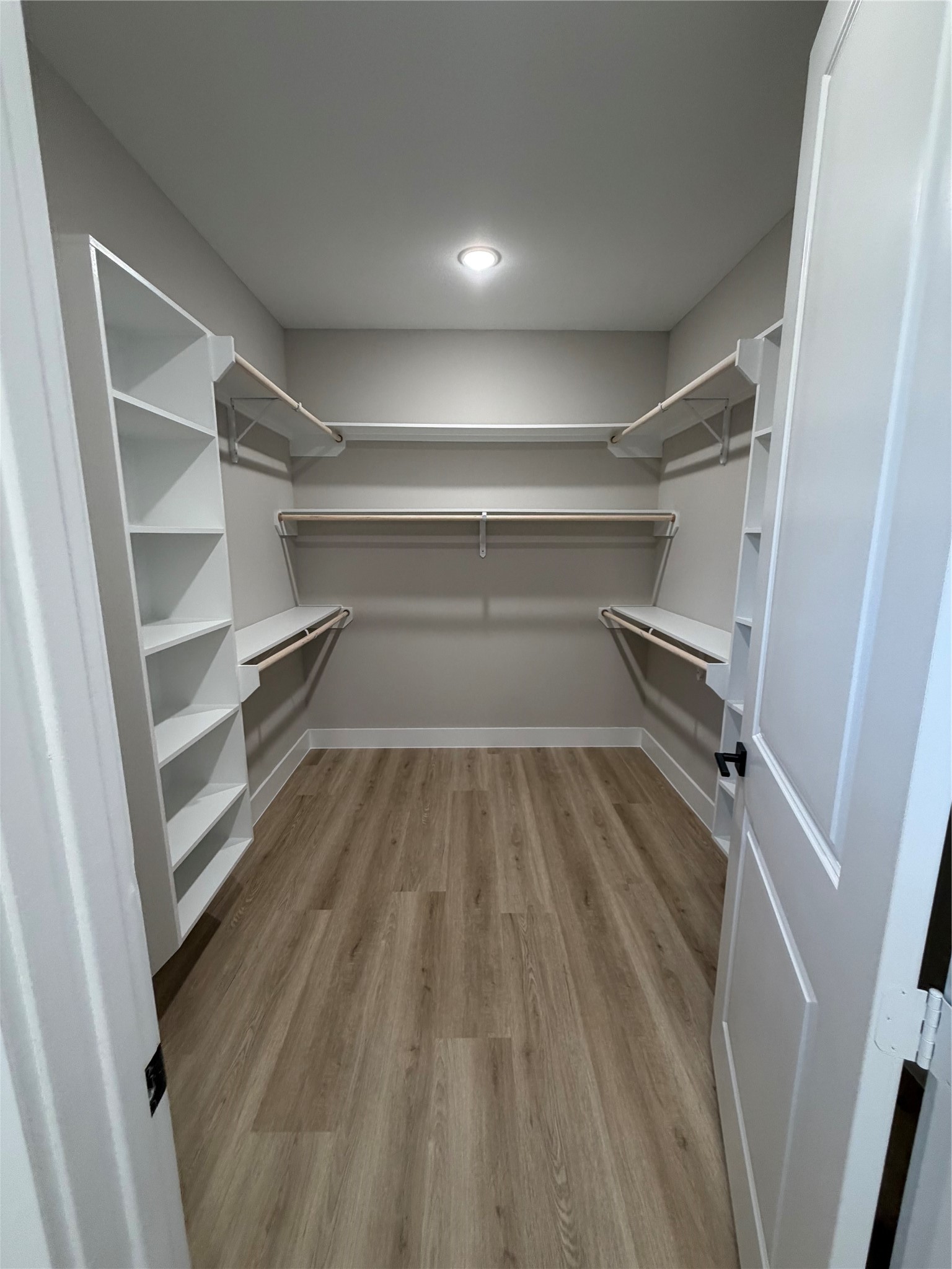 2523 Liguria Lane Spring, TX 77388 - Photo 10 of 30 a view of walk in closet with empty racks