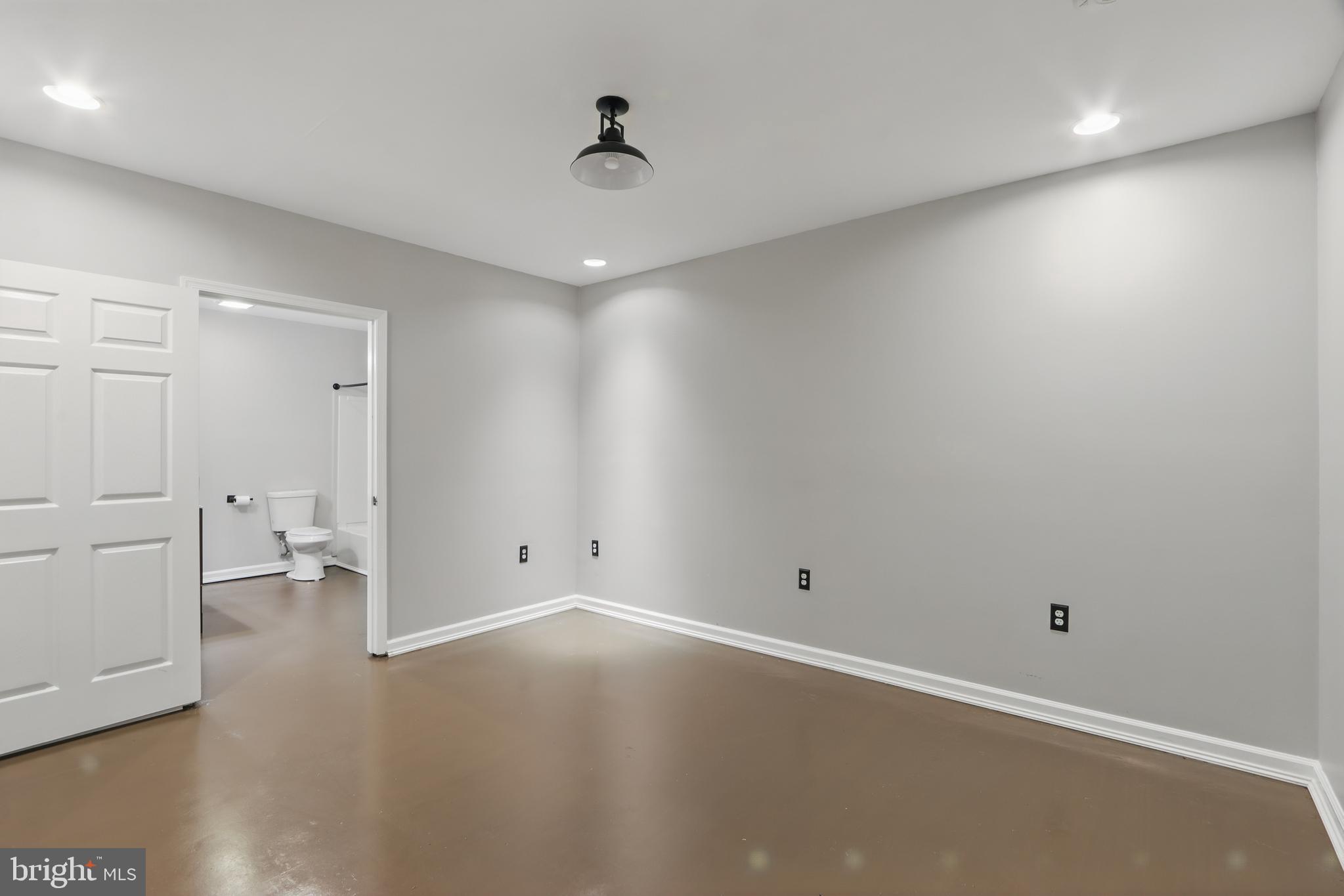 5185 Meadows Farm Road Lothian, MD 20711 - Photo 15 of 29 an empty room with wooden floor and windows