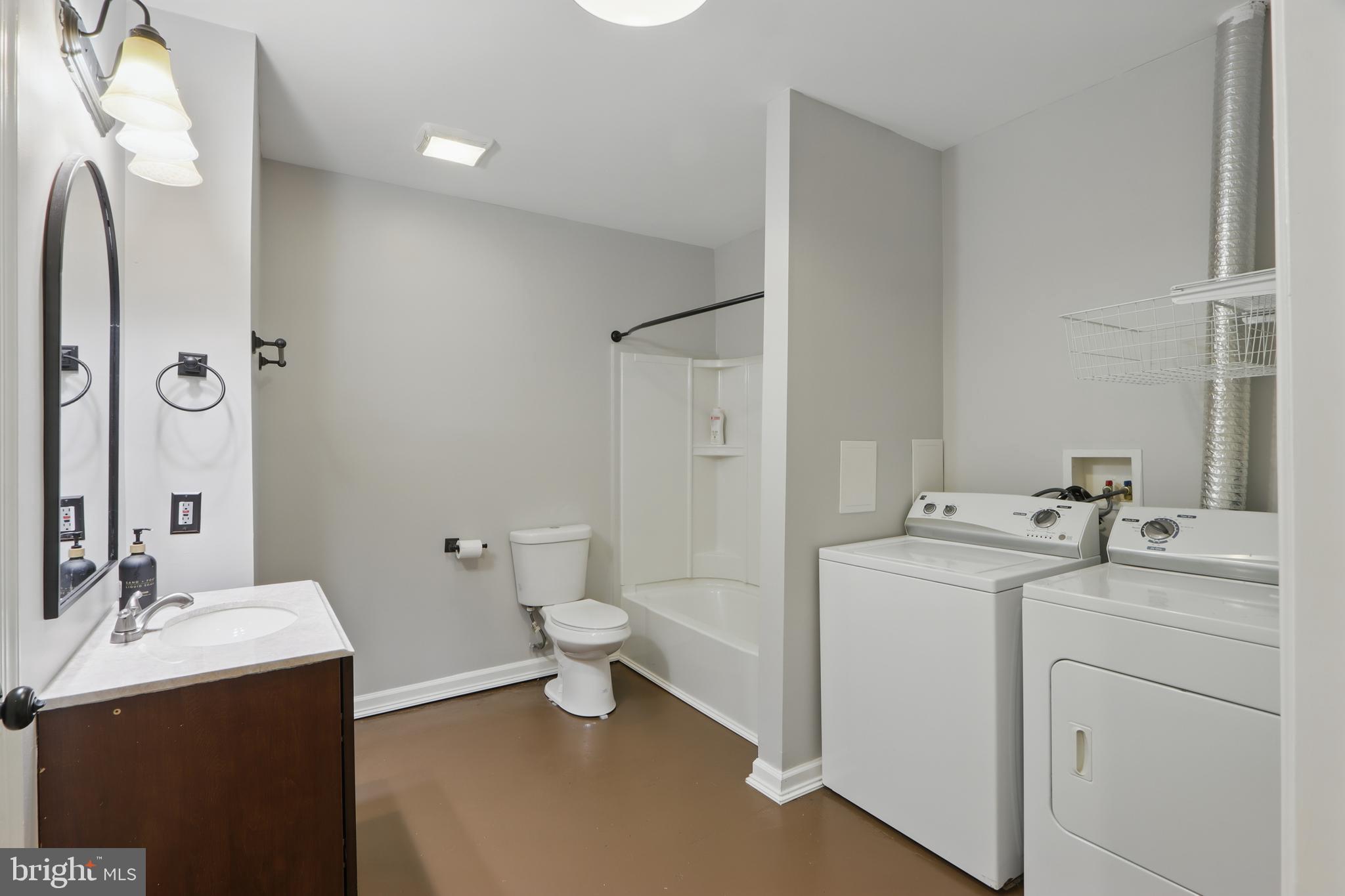 5185 Meadows Farm Road Lothian, MD 20711 - Photo 16 of 29 a bathroom with a sink toilet and shower