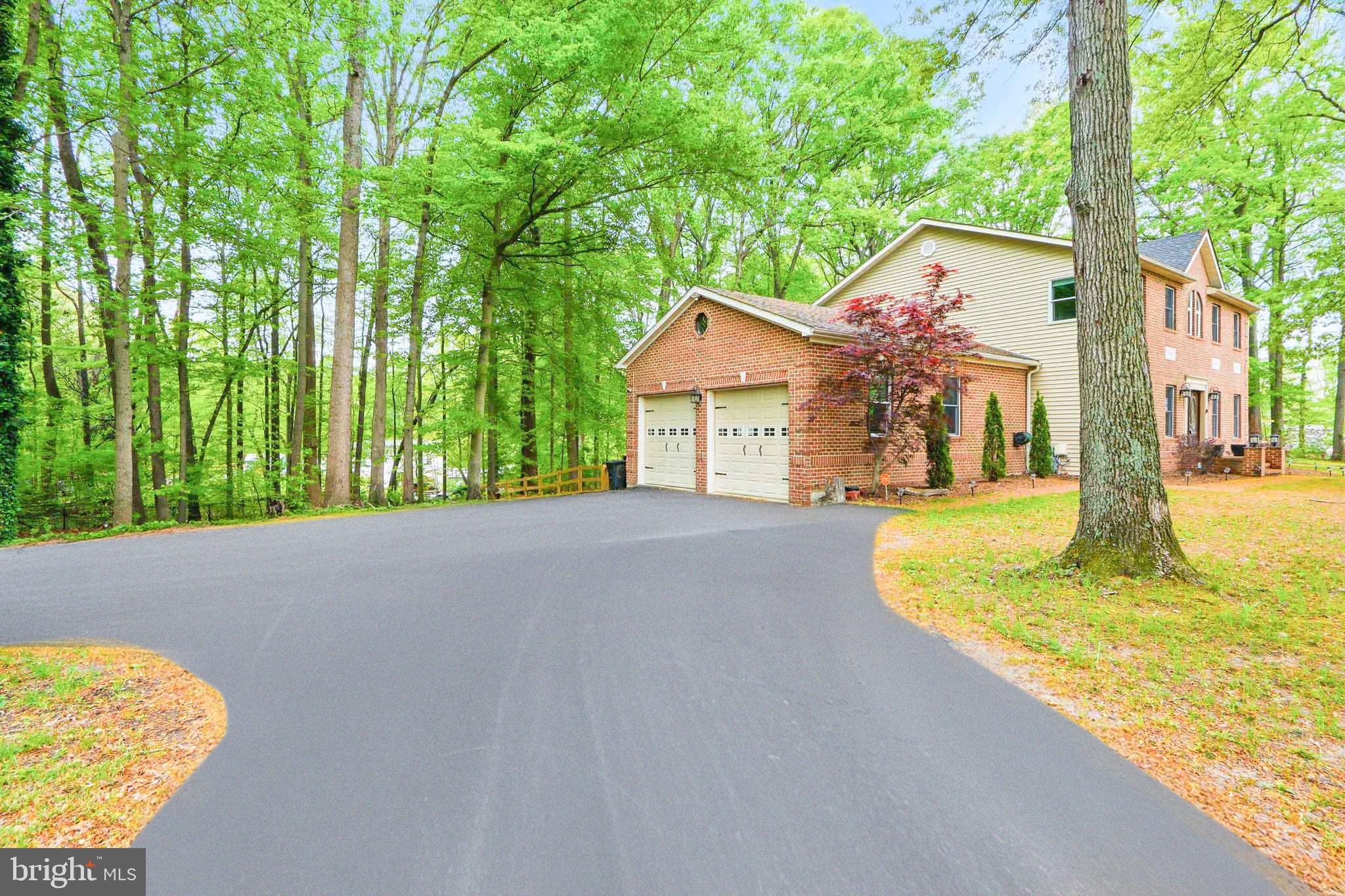 5185 Meadows Farm Road Lothian, MD 20711 - Photo 2 of 29 a view of a house with a swimming pool
