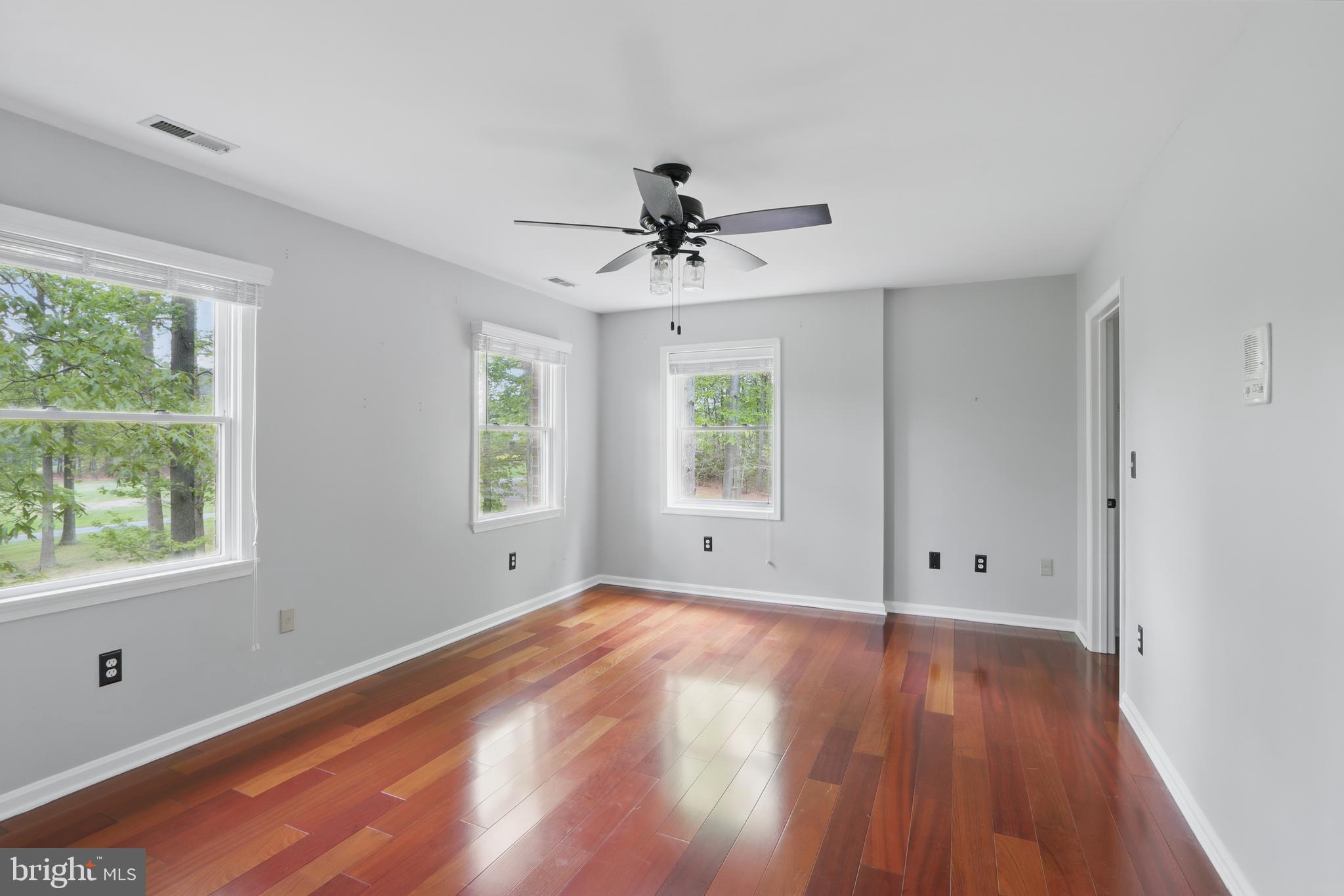 5185 Meadows Farm Road Lothian, MD 20711 - Photo 21 of 29 wooden floor in an empty room with a window