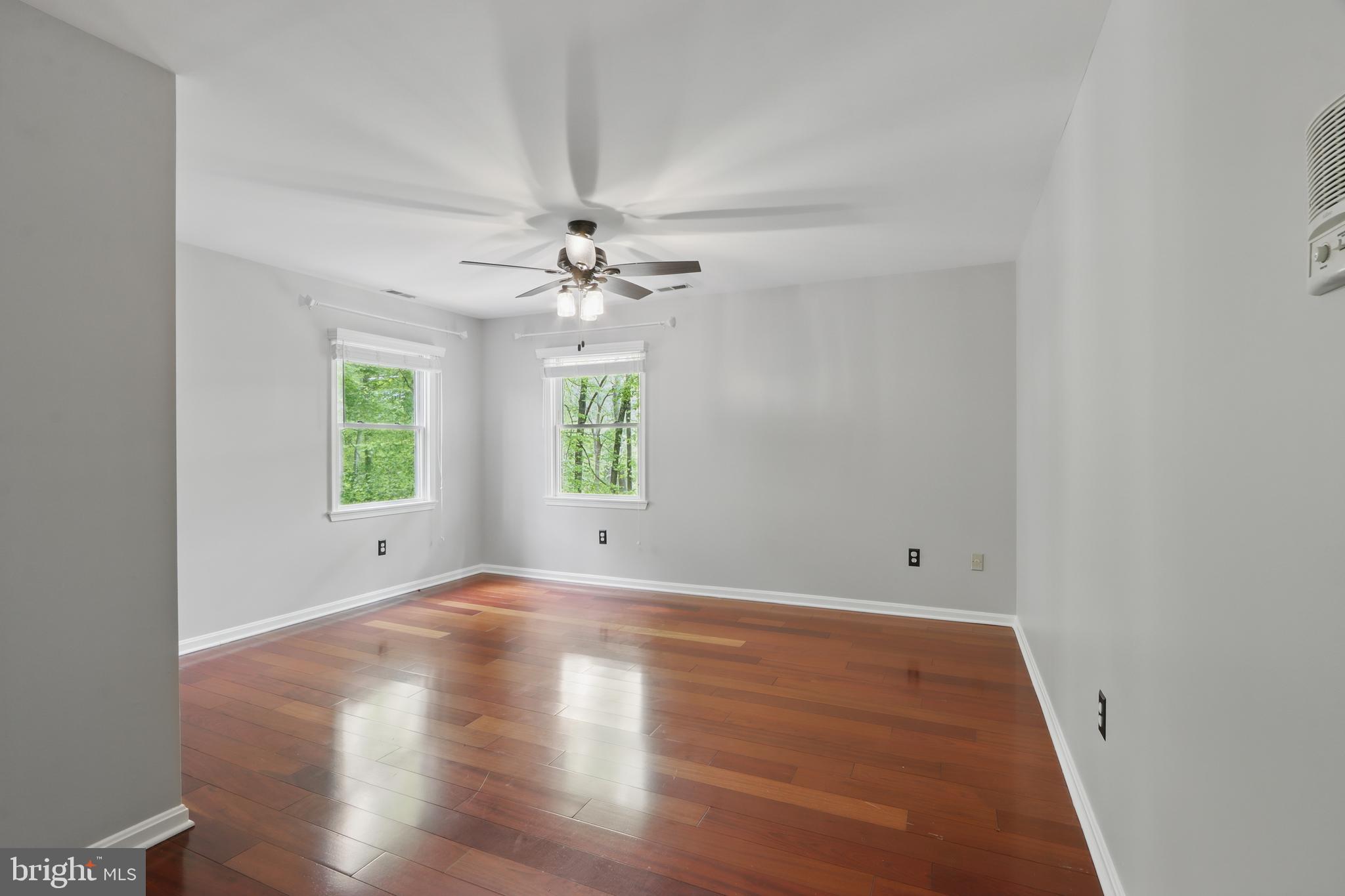 5185 Meadows Farm Road Lothian, MD 20711 - Photo 25 of 29 wooden floor in an empty room with a window